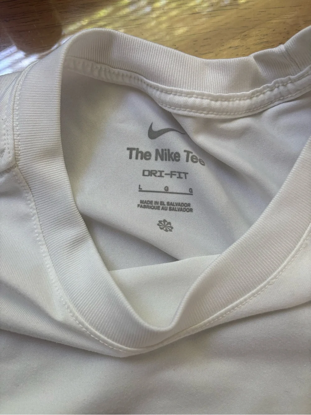 Nike White Short Sleeve Performance Tee with Black Swoosh